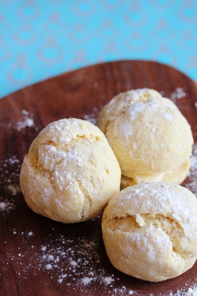 Gluten free white rolls on a wooden board. #glutenfree #freefromfairy #glutenfreebread #glutenfreerollrecipe