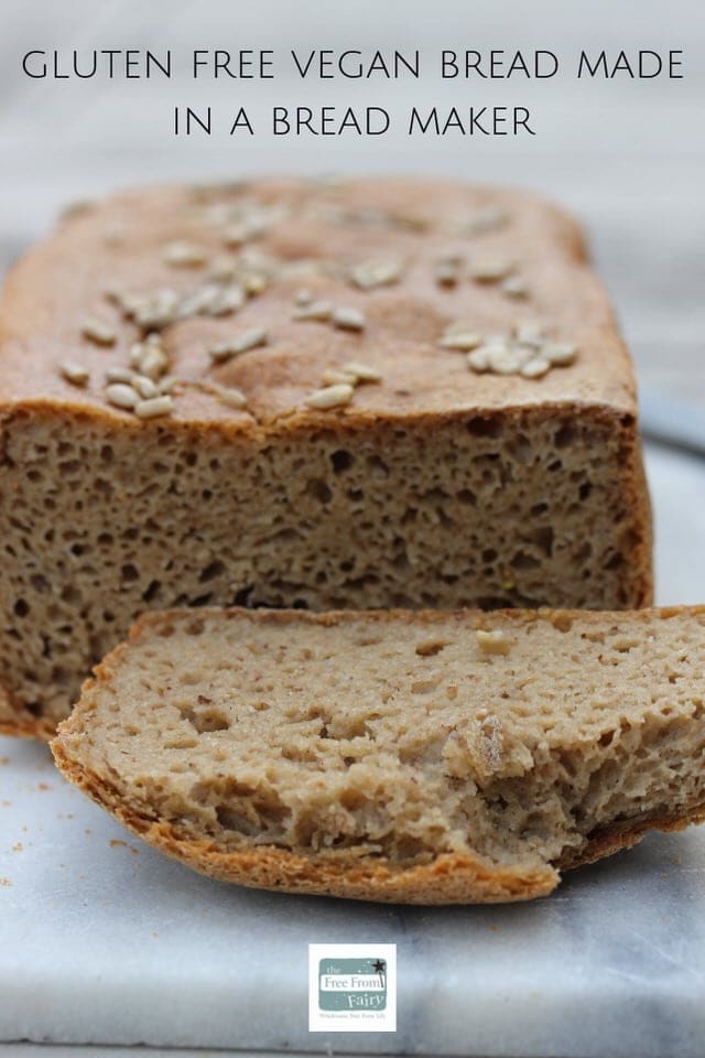 A graphic showing a picture of the cu end of a loaf with the crust slice laying in front of it. There is a bite taken out the top of the slice. The text above the loaf reads "Gluten Free Vegan Bread Made In A Bread Maker"