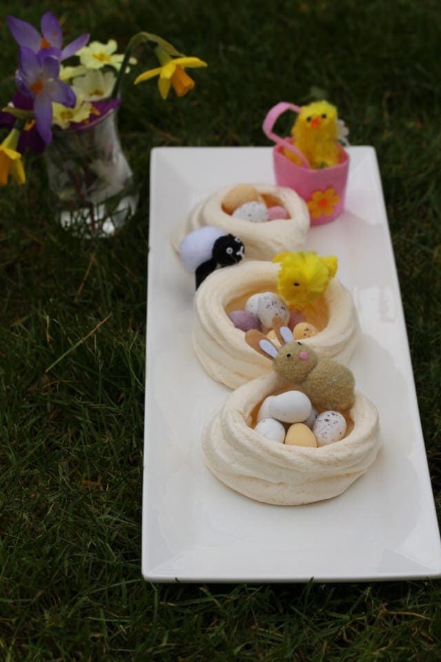 Easter nests with baby animals on the grass