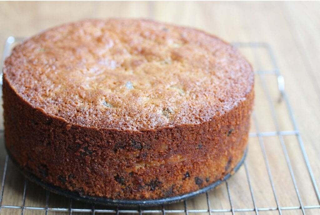 Gluten free fruit cake cooling on a wire rack