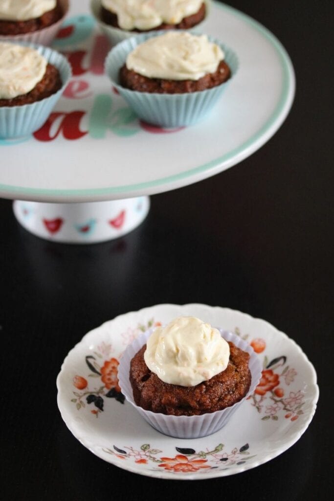 sugar free carrot cake muffins on a cake stand