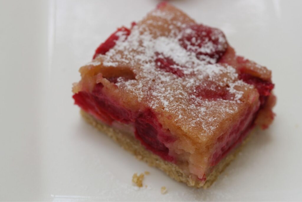 Close up photograph of a slice of gluten free cherry pie from above