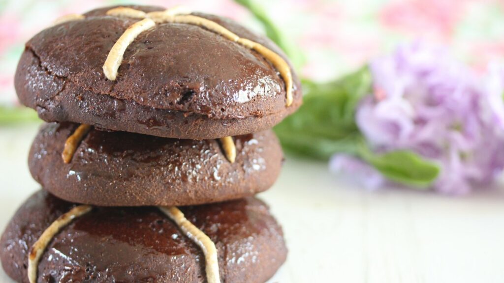 A stack of vegan, gluten free hot cross buns